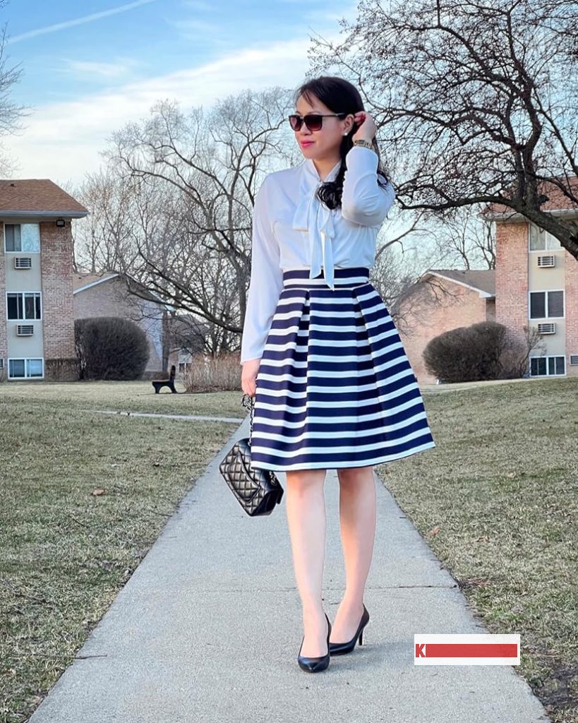 Navy and white striped skirt
Outfit for Wedding Guest with 
White t-shirt, Navy ballet flats and a 
White tote Bag