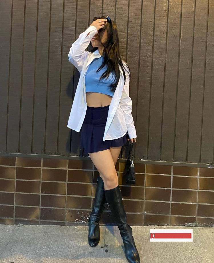 Fashionable fall mini blue skirt with crop top and white dress shirt