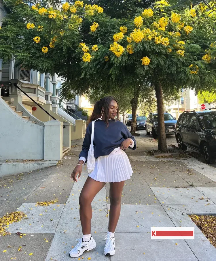 White Tennis Skirt with Pullover Sweater Blue and sneakers